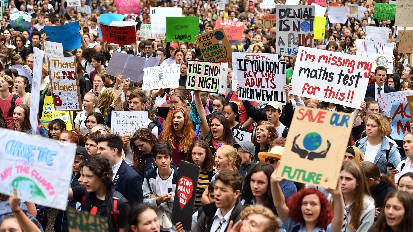 A crowd of students and young people protesting at a climate rally in Australia.