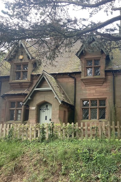 Old school house made of sandstone in Little Witley