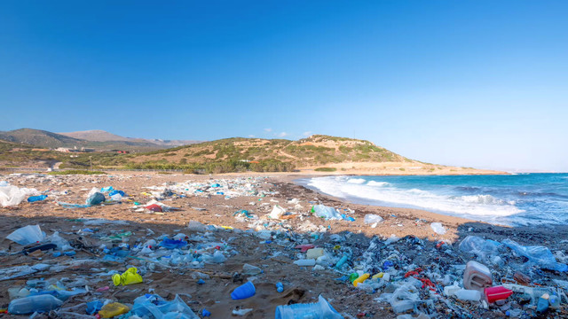 PHOTO: Piles of plastic trash covering a beach stretch for miles into the distance.