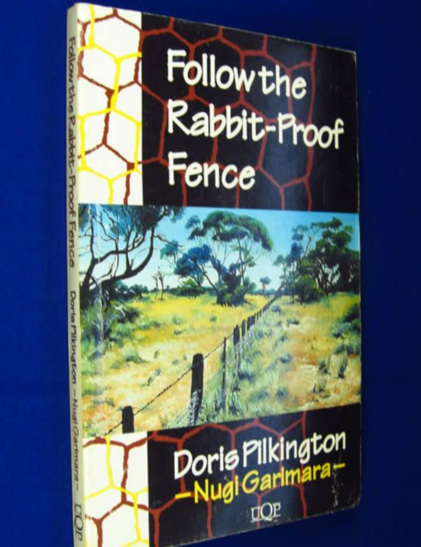 Book cover for FOLLOW THE RABBIT PROOF FENCE by Doris Pilkington

Artists drawing of the Australian outback; yellowed scrub brush dotted with green leafed trees. Thru the center of it all runs a fence with wooden posts, rabbit fence along the bottom and 1 strand of barbed wire across the top.